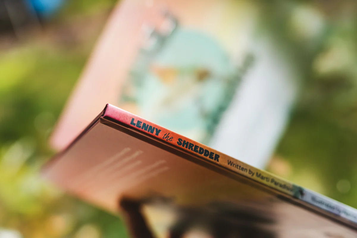 Book titled 'Lenny the Shredder' with a blurred outdoor background shed nine