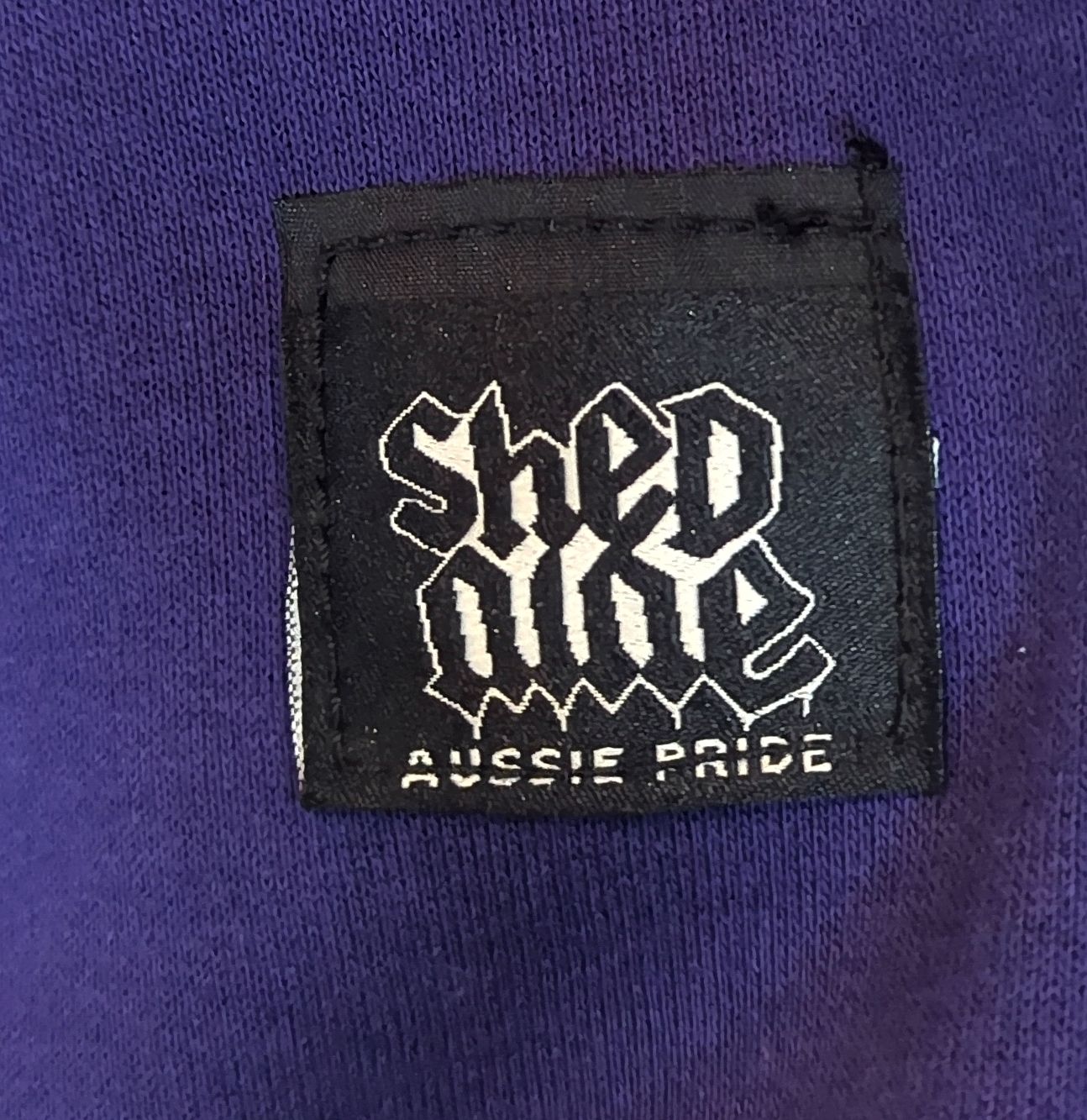 Black label with white text on a purple background