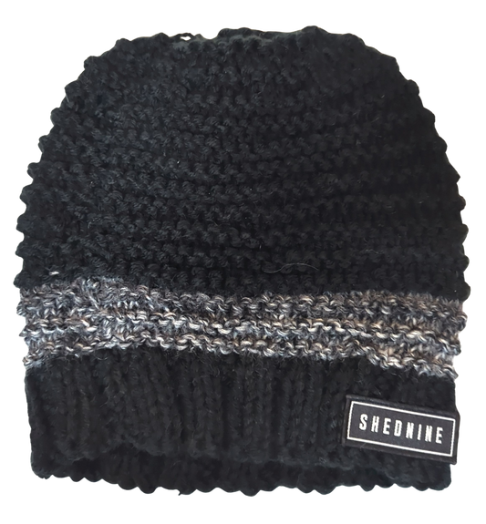 Black knit beanie with gray stripe and Shed Nine label on a white background