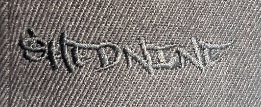 Embroidered design on a fabric surface