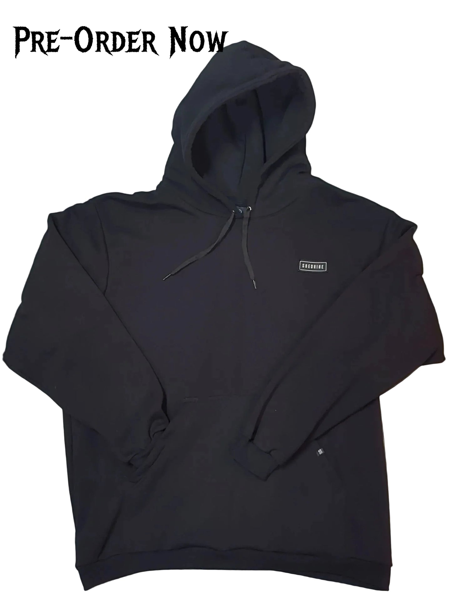 Black hoodie with a small logo on a white background, pre-order now text at the top.