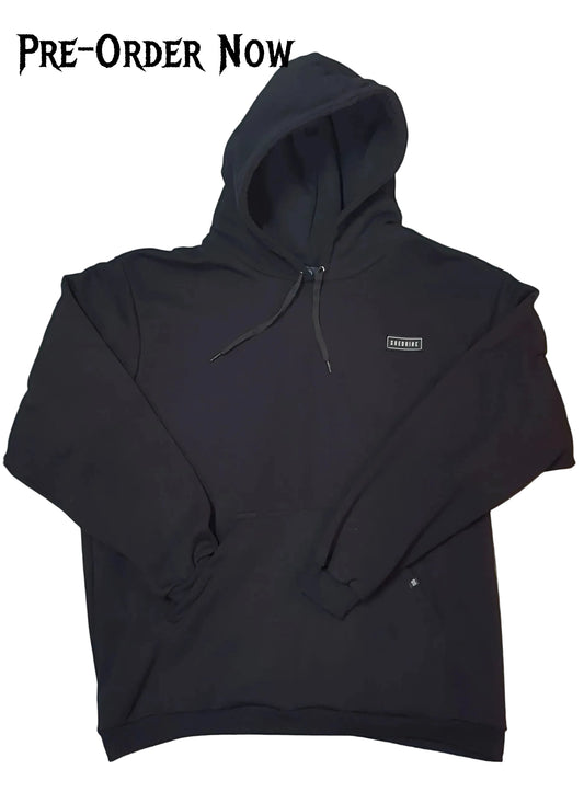 Black hoodie with a small logo on a white background, pre-order now text at the top.