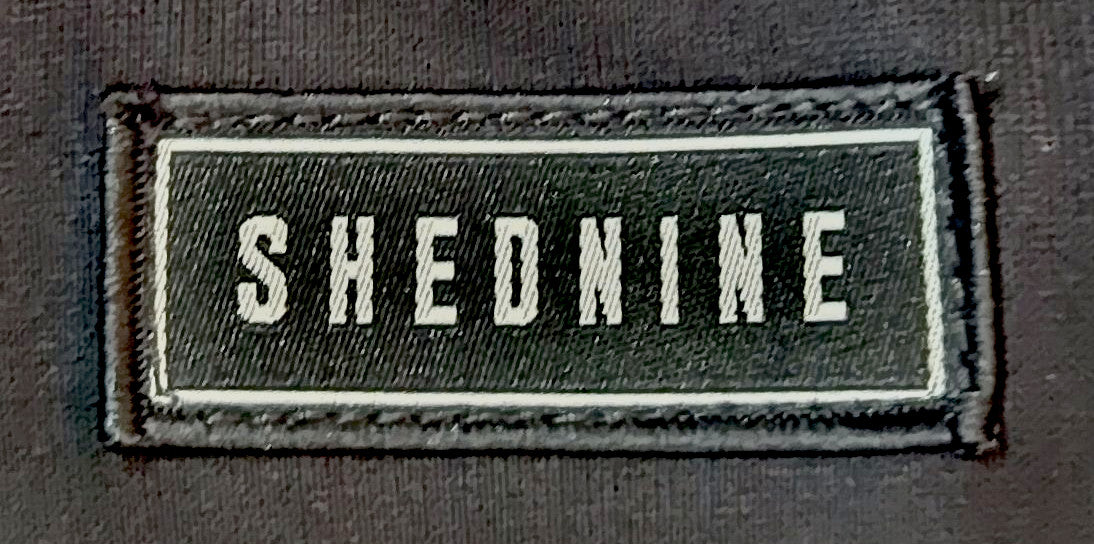 Shed Nine Black Logo