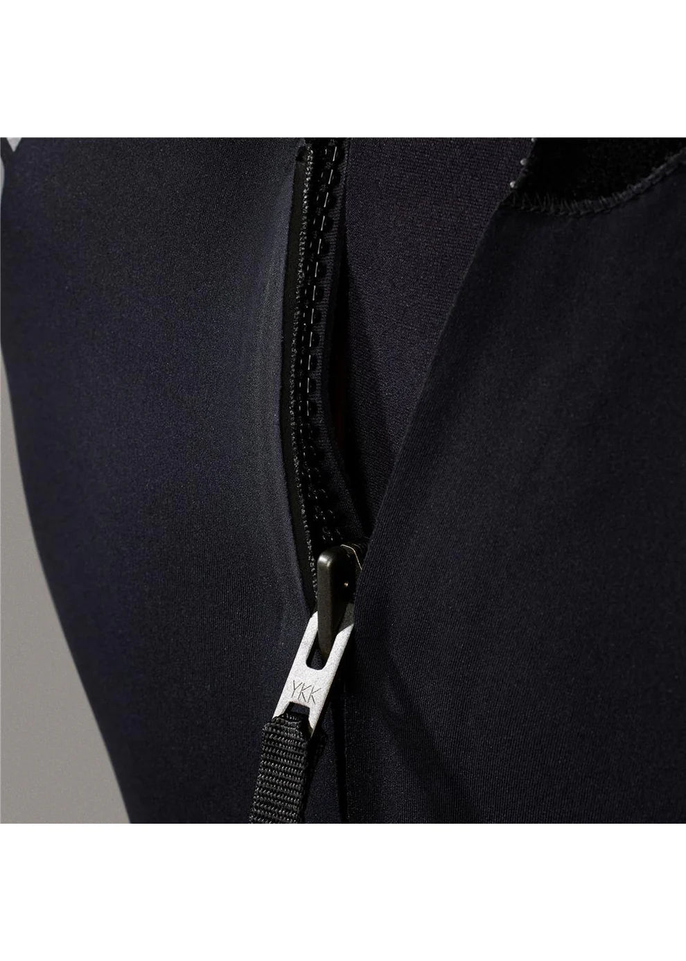 Close-up of a black WETSUIT with a zipper, featuring a brand logo.