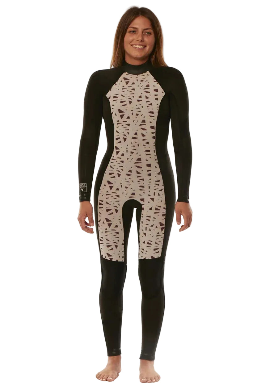 Woman wearing a black and beige patterned wetsuit on a white background SHED NINE