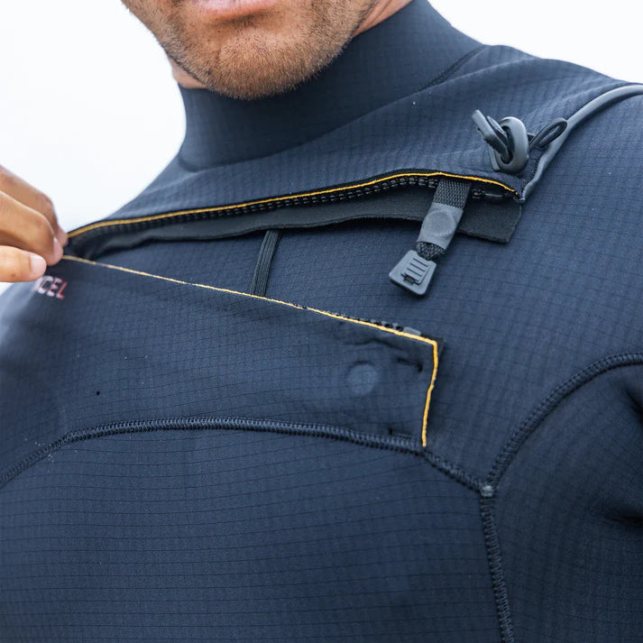 Close-up of a person wearing a navy blue jacket with a brand logo on a white background shed nine