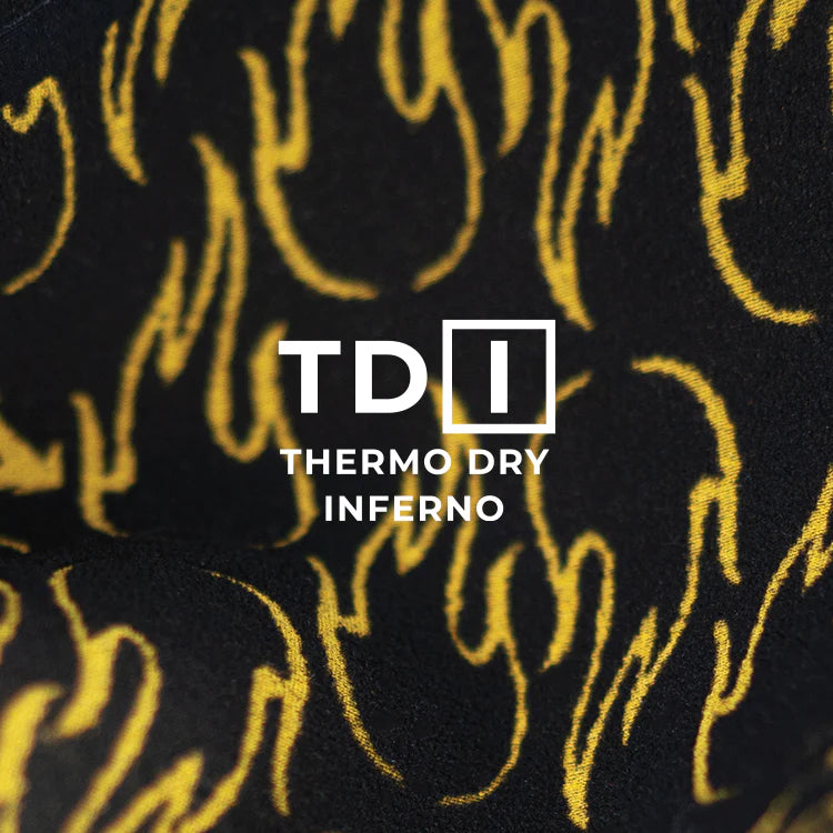 Textured black and gold fabric with 'TDI Thermo Dry Inferno' branding. shed nine
