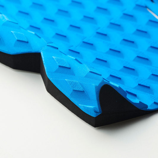 Balin Divide 2-Piece Deck Grip, close-up of blue textured deck pad and black raised tail edge