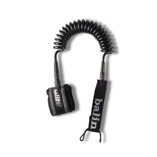 Balin Downwind / Foil Coil 8.0mm SUP Leash, black coiled leash laid out with cuff and rail saver