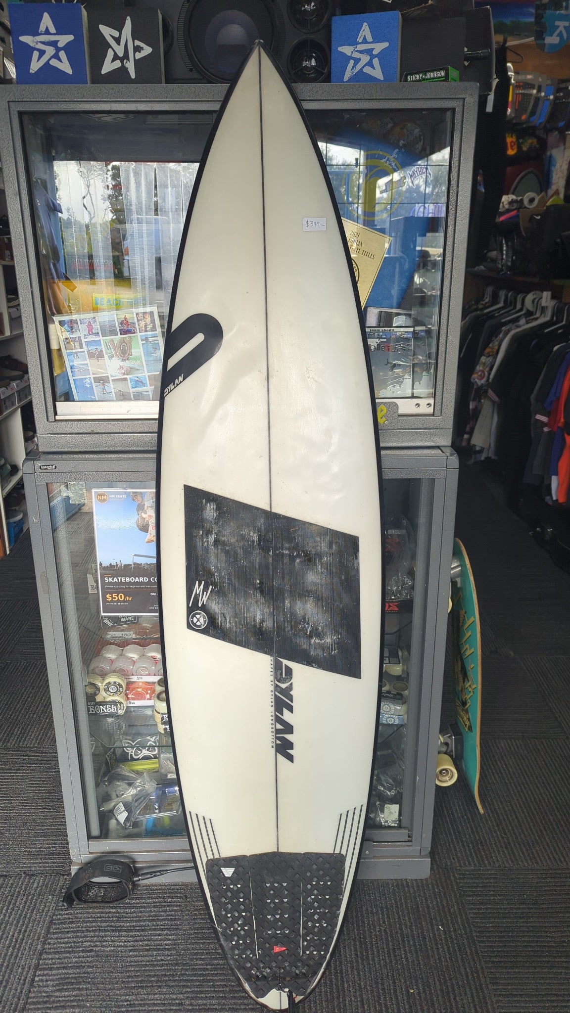 Dylan Longbottom Predator secondhand surfboard deck with fitted traction pads and visible wear
