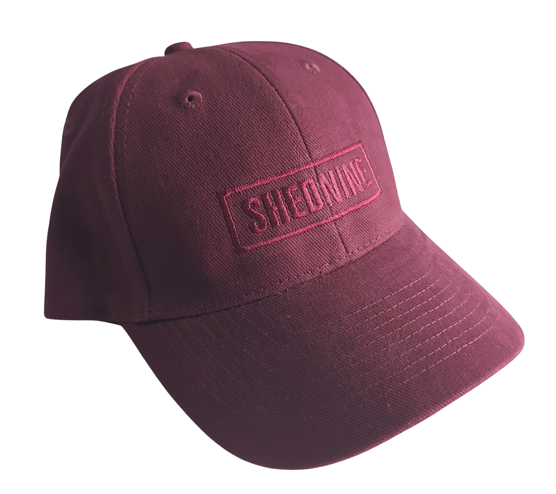 Maroon cap with 'SHEDNINE' logo on a white background
