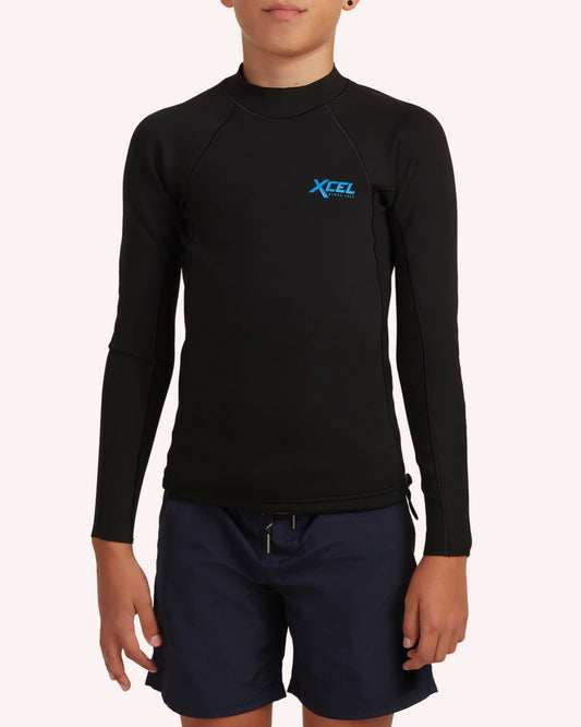 Person wearing a black long-sleeve rash guard with XCEL logo on a white background