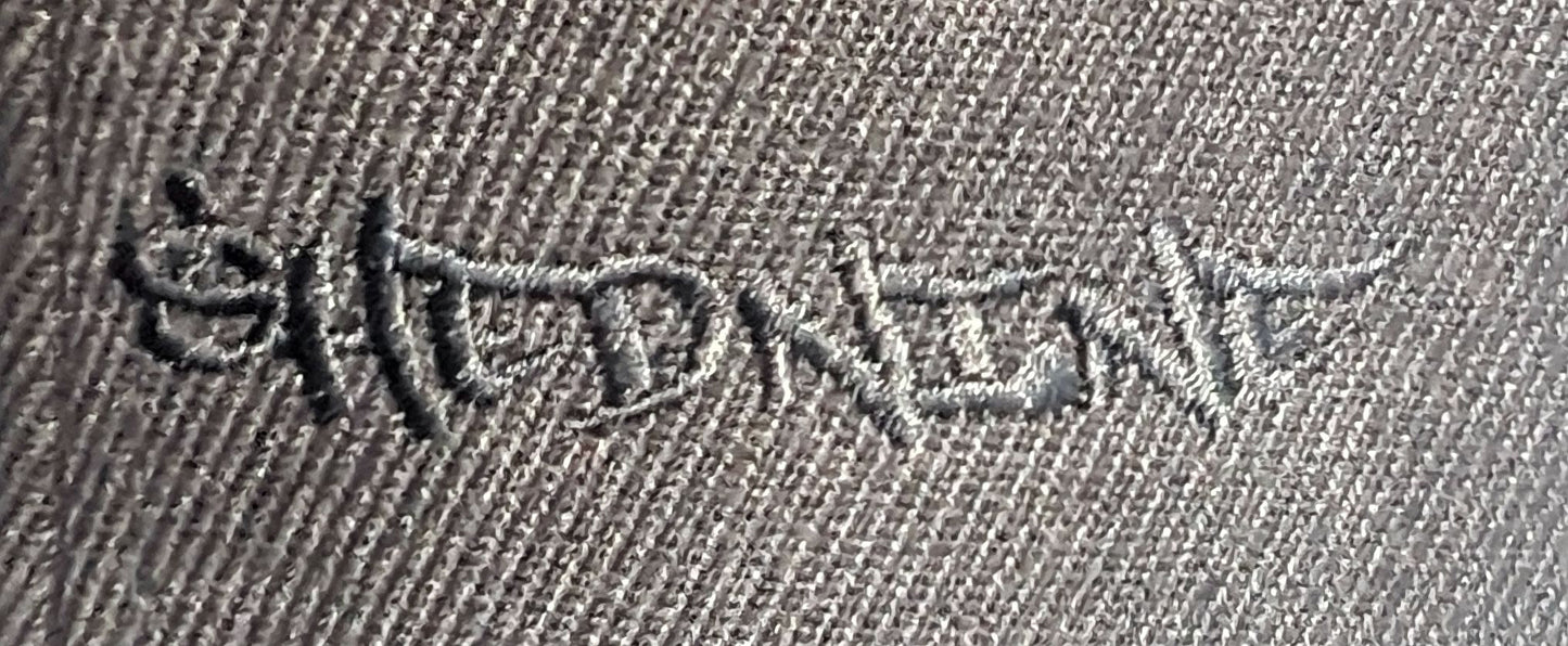 Embroidered design on a fabric surface