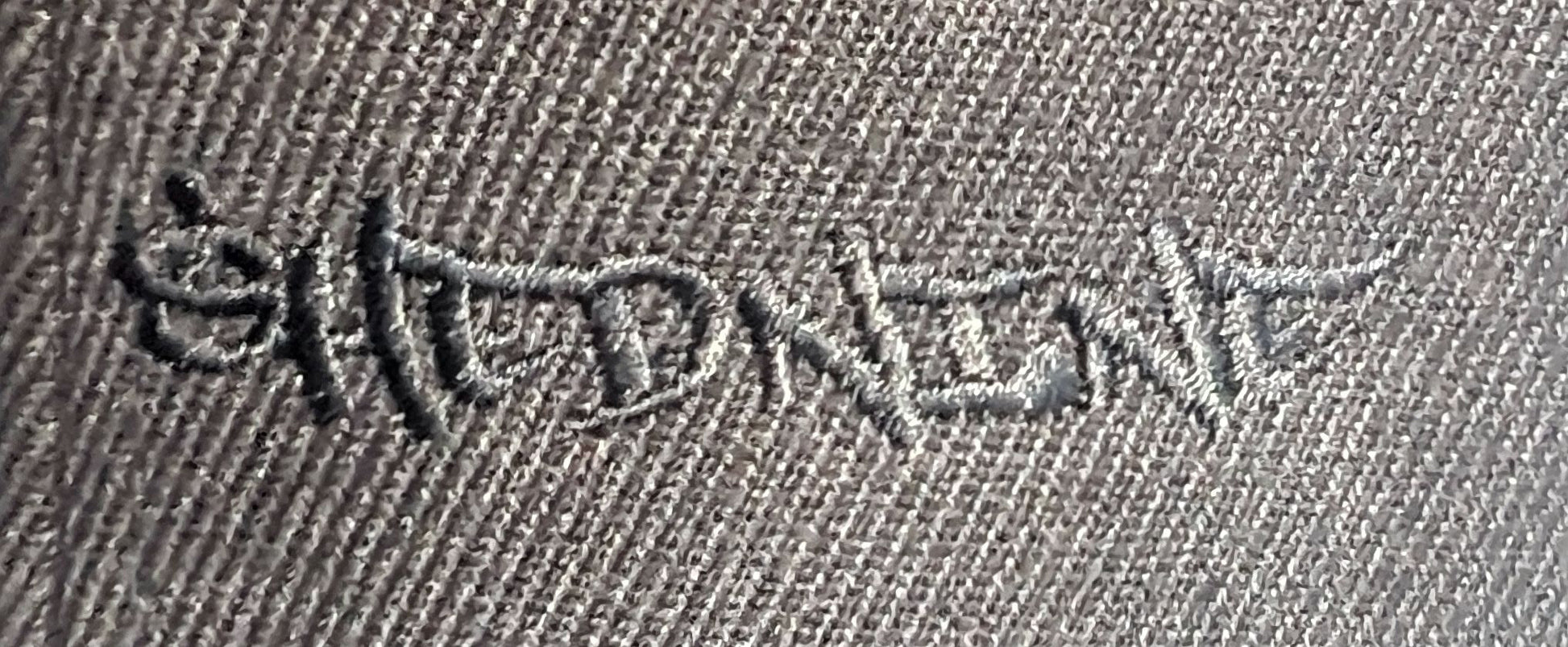 Embroidered design on a fabric surface