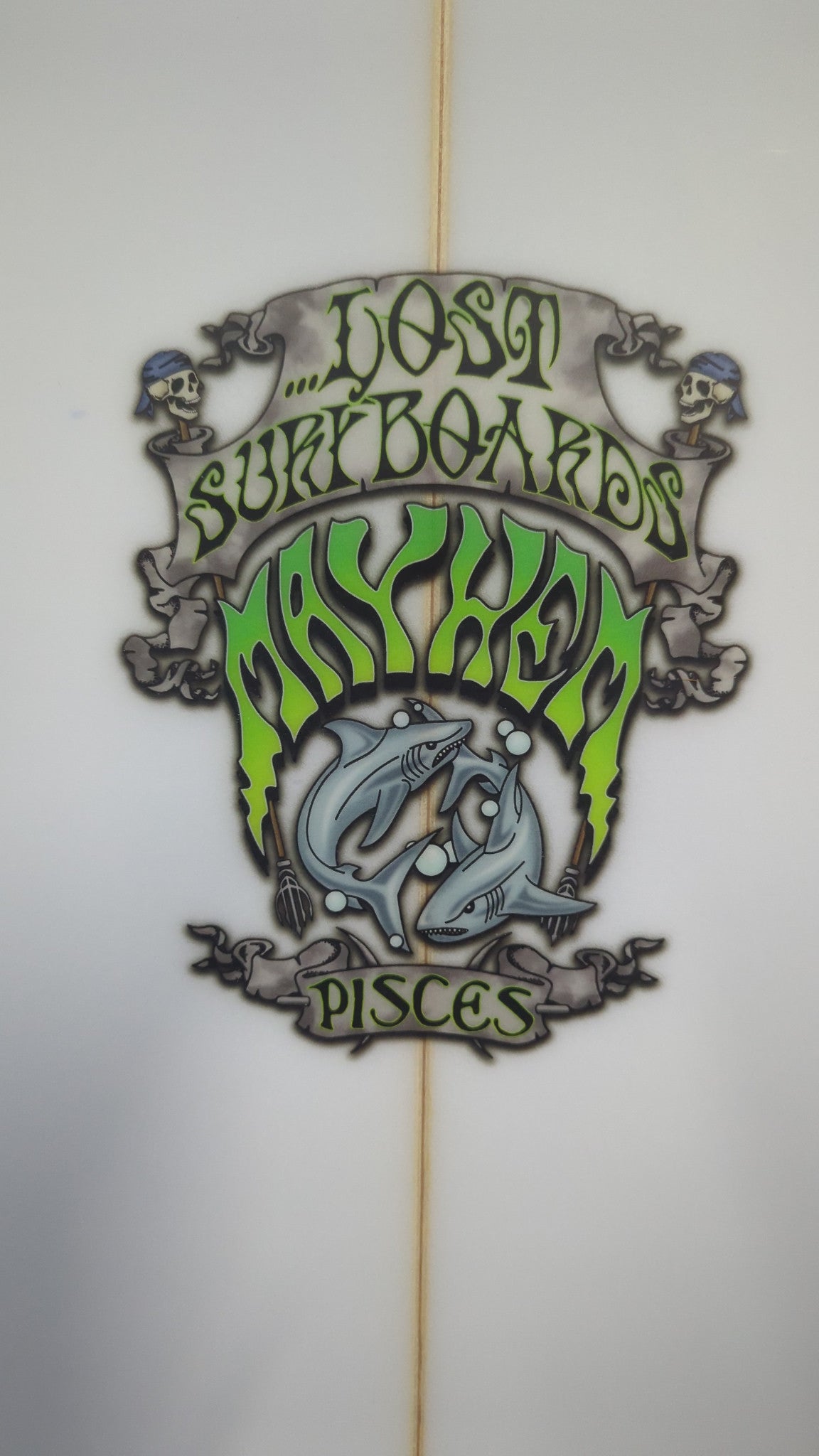 Close-up of the green Lost Mayhem Pisces logo on the actual board stocked at Shed Nine