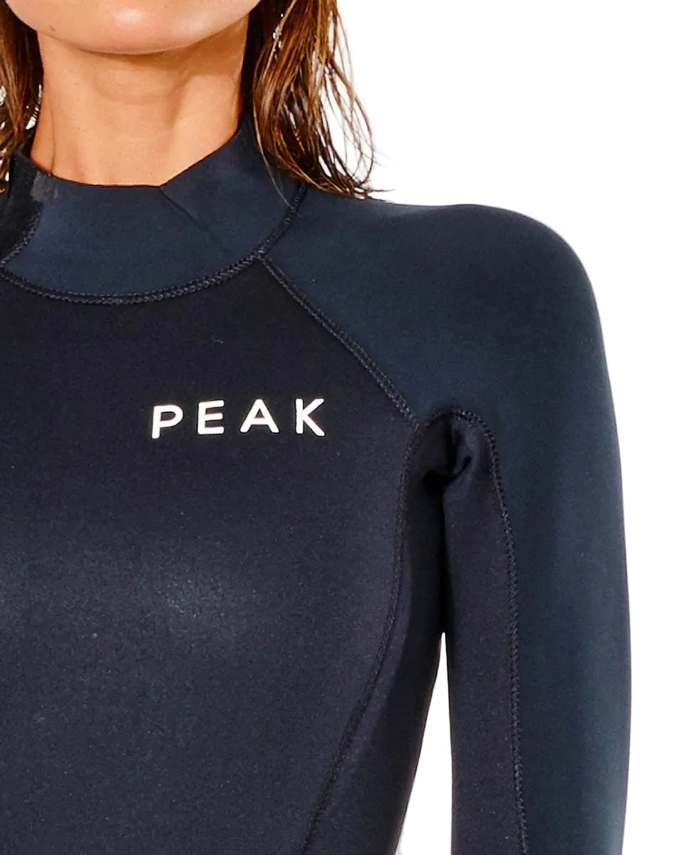 Chest logo detail on Peak Women’s Energy 4/3GB Back Zip Steamer Wetsuit in black shed nine