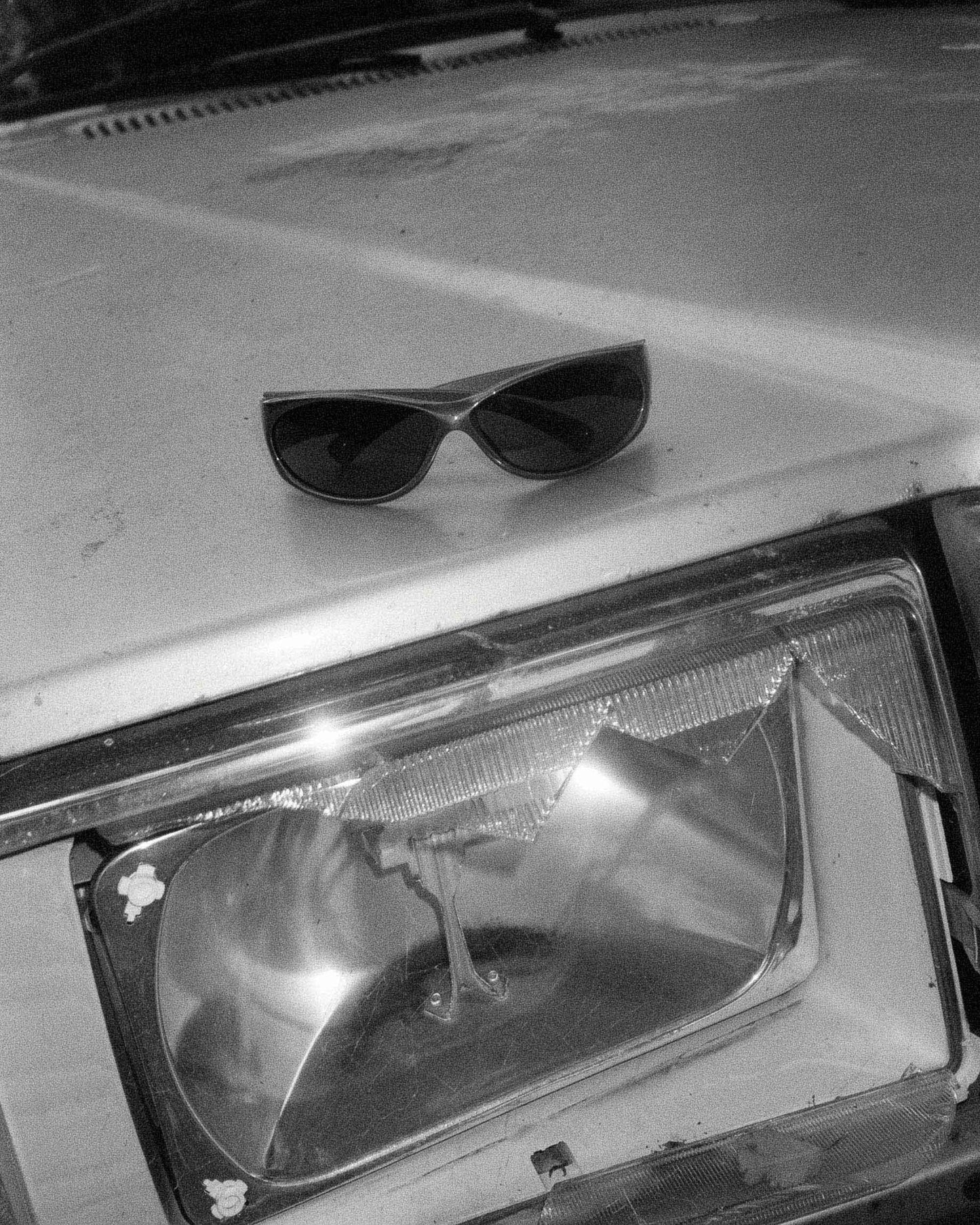 Product detail of Ritual Vision Demon Speed Sunglasses in Matte Chrome / Blue Reflective Polarised 65 mm resting on a car shed nine