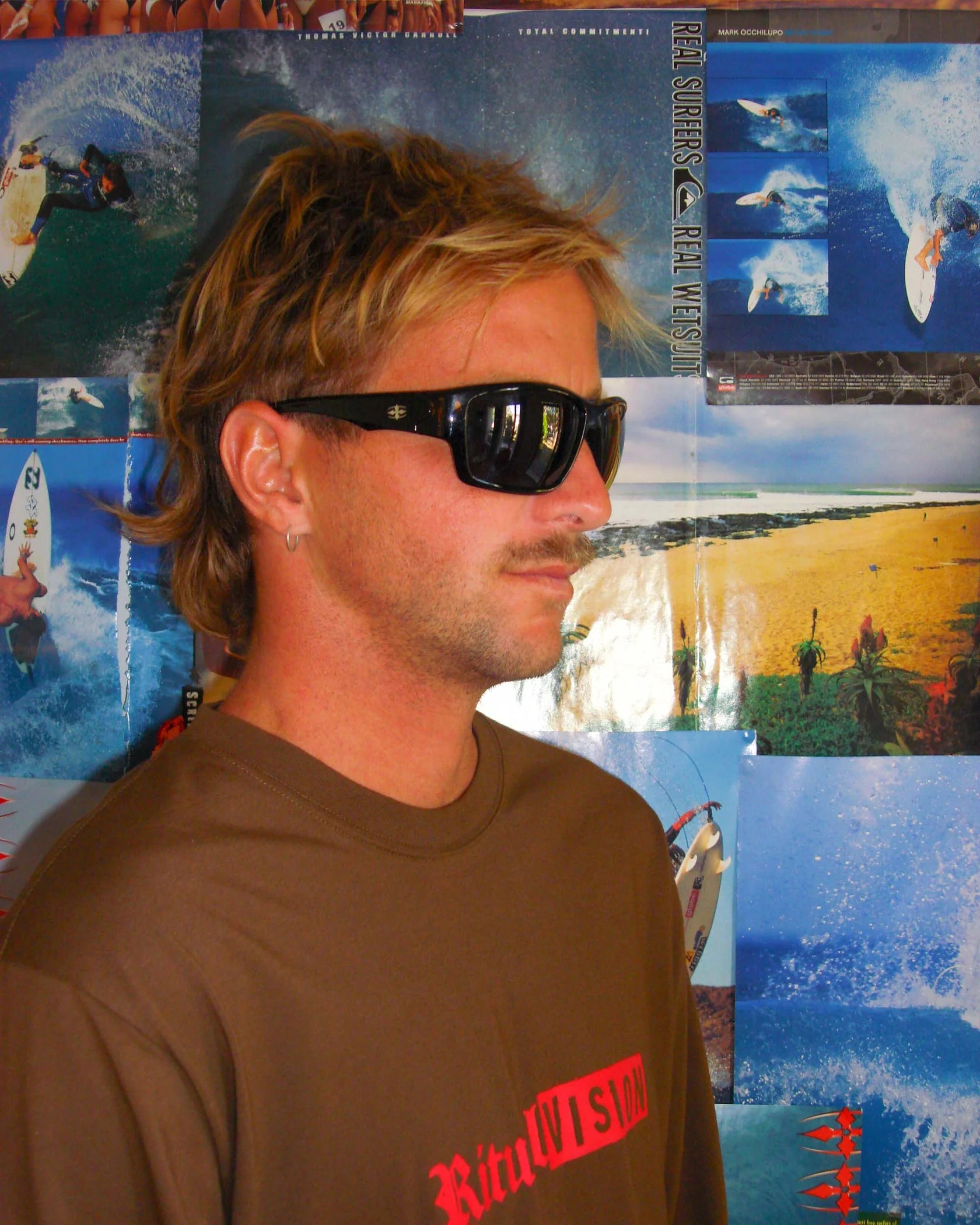 Side portrait of model wearing Ritual Vision The Decline Sunglasses in Black / Black Polarised 63 mm shed nine