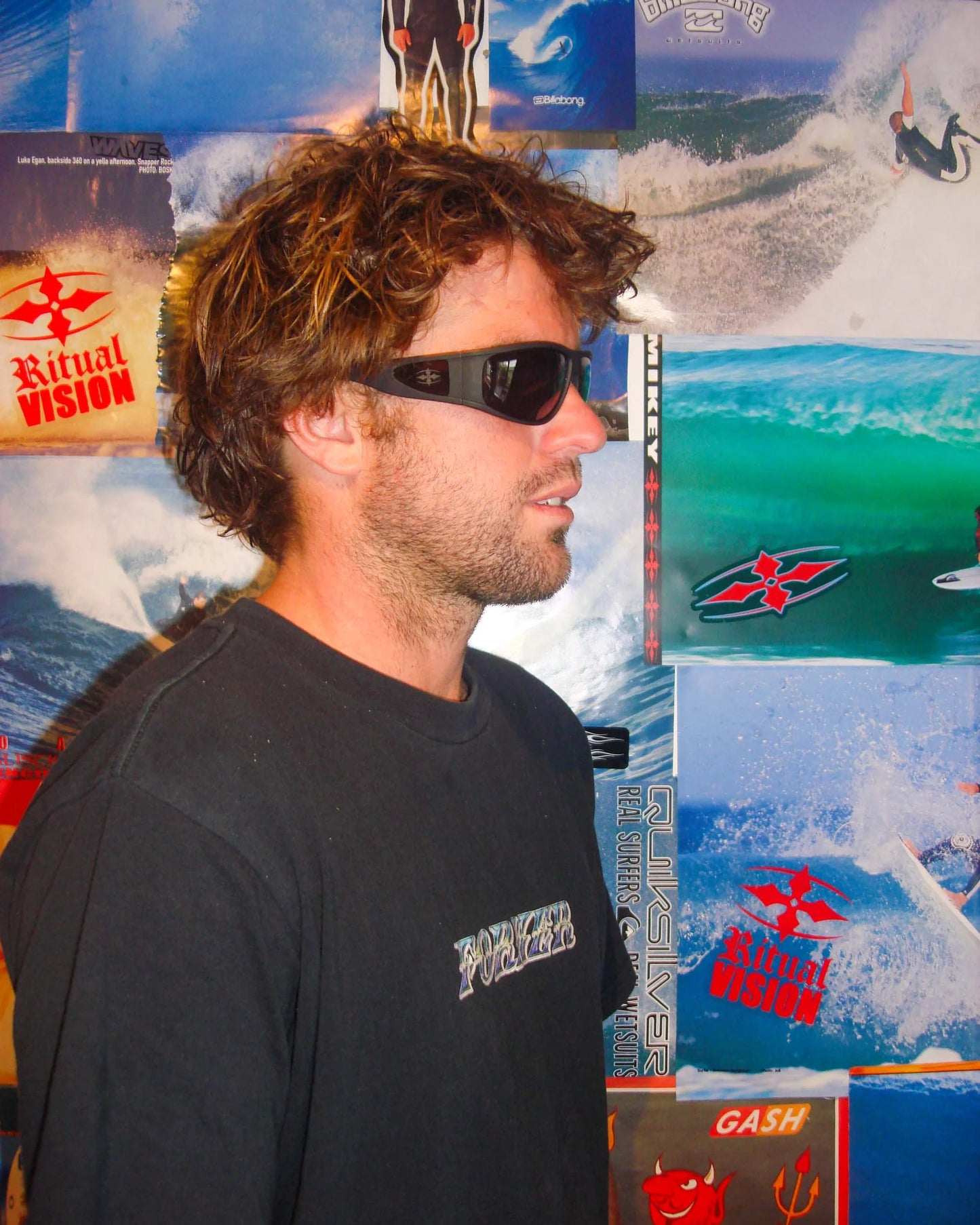 Side portrait of model wearing Ritual Vision The Vacationer Sunglasses in Matte Black / Black Polarised shed nine