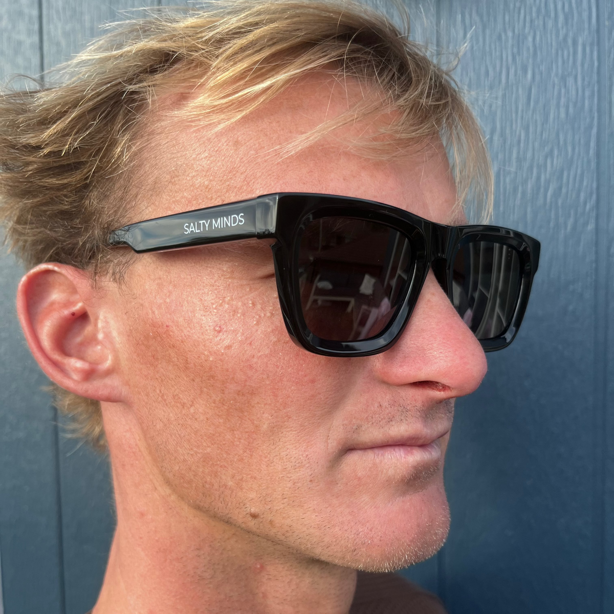 Salty Minds The Governor black sunglasses worn at an angle