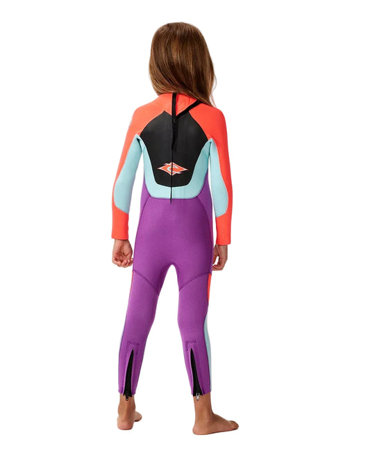 Child wearing a colorful wetsuit on a white background shed nine