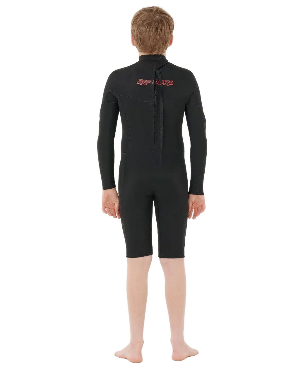 shed nine Person wearing a black wetsuit with red branding on a white background