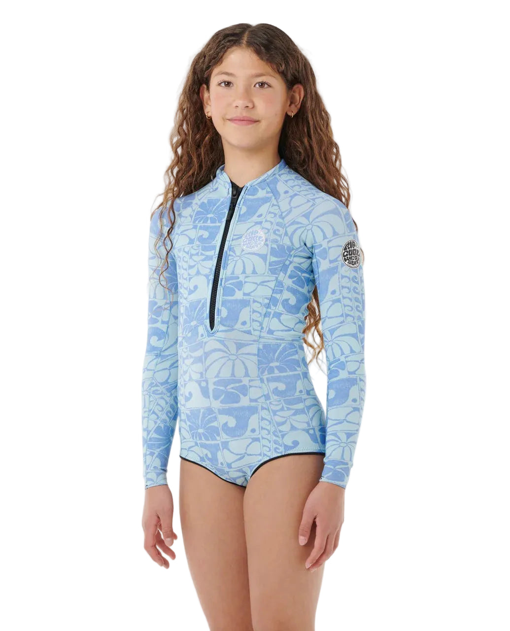 Girl wearing a blue floral rash guard on a white background shed nine
