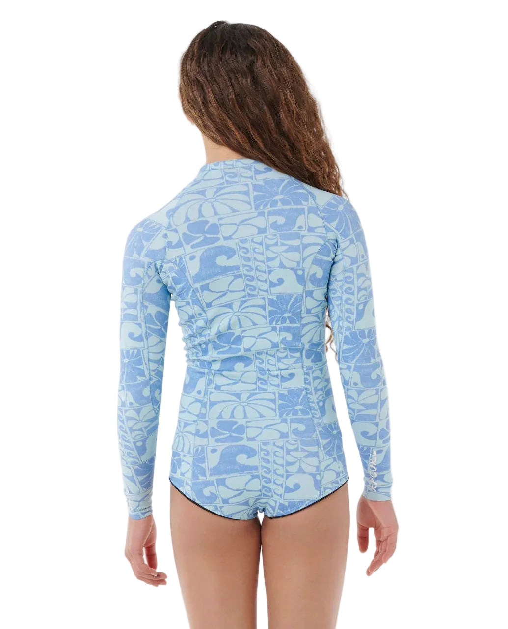 Woman wearing a blue patterned long-sleeve rash guard on a white background shed nine