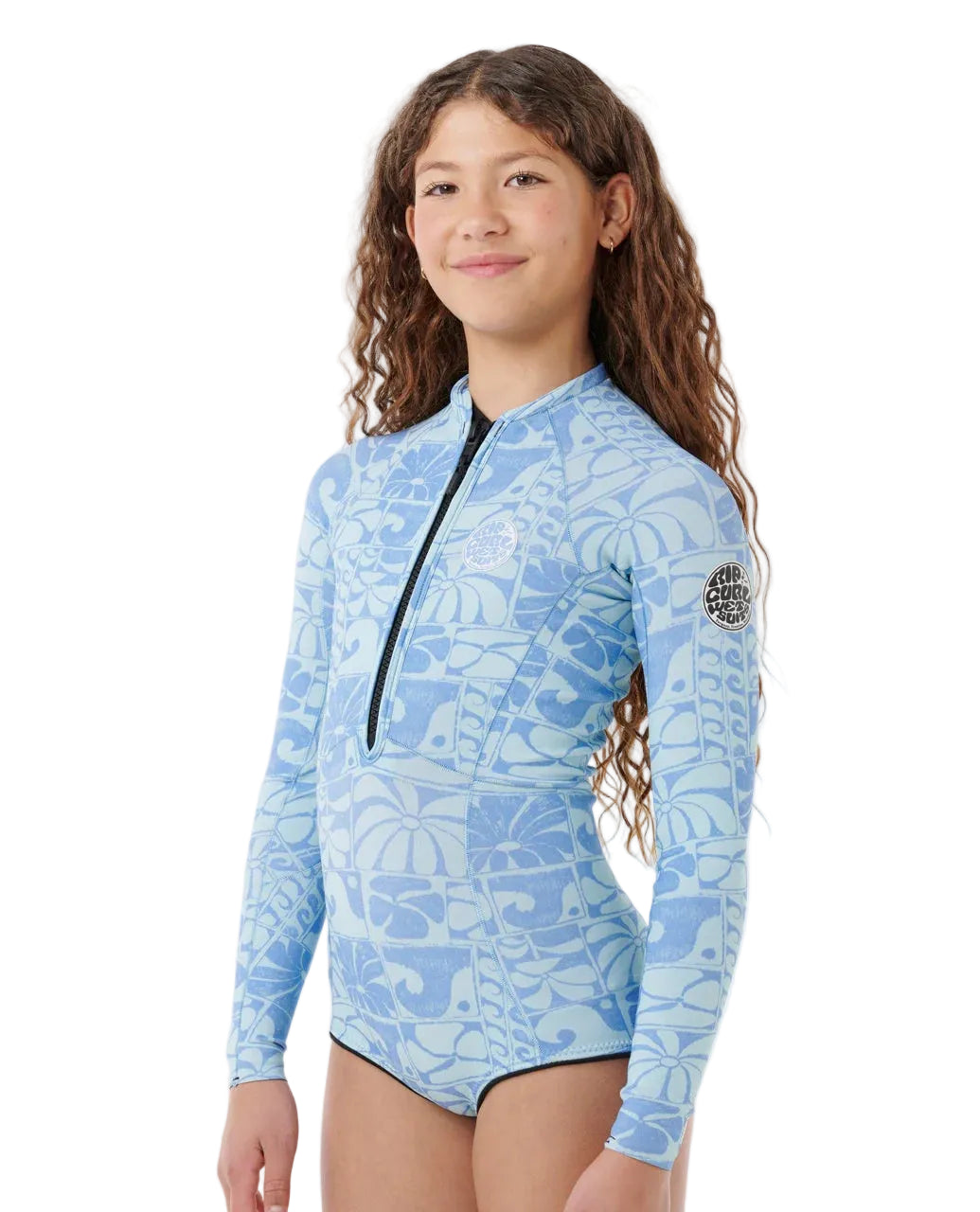 Girl wearing a blue patterned long-sleeve rash guard on a white background shed nine