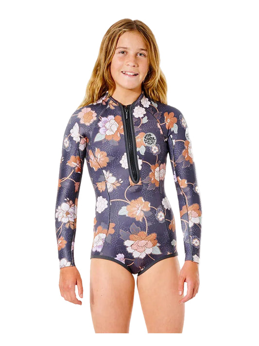 Girl wearing a floral-patterned wetsuit on a white background shed nine
