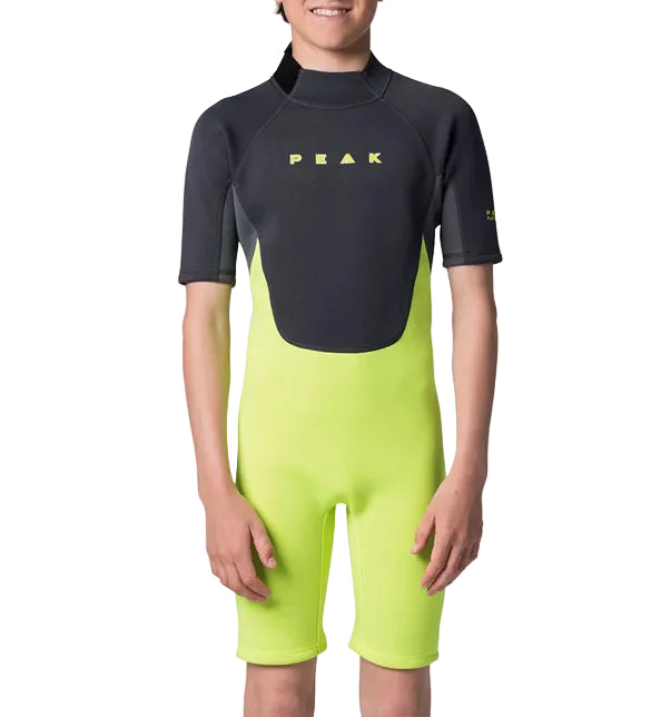 Child wearing a black and green wetsuit with 'Peak' branding on a white background shed nine