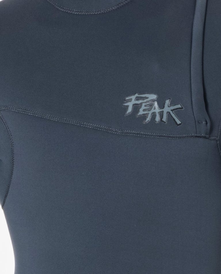 Close-up of a dark gray sleeveless top with 'Peak' logo on a white background shed nine