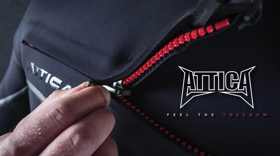 shed nine Attica bag with red zipper being pulled open by a hand, Attica logo visible
