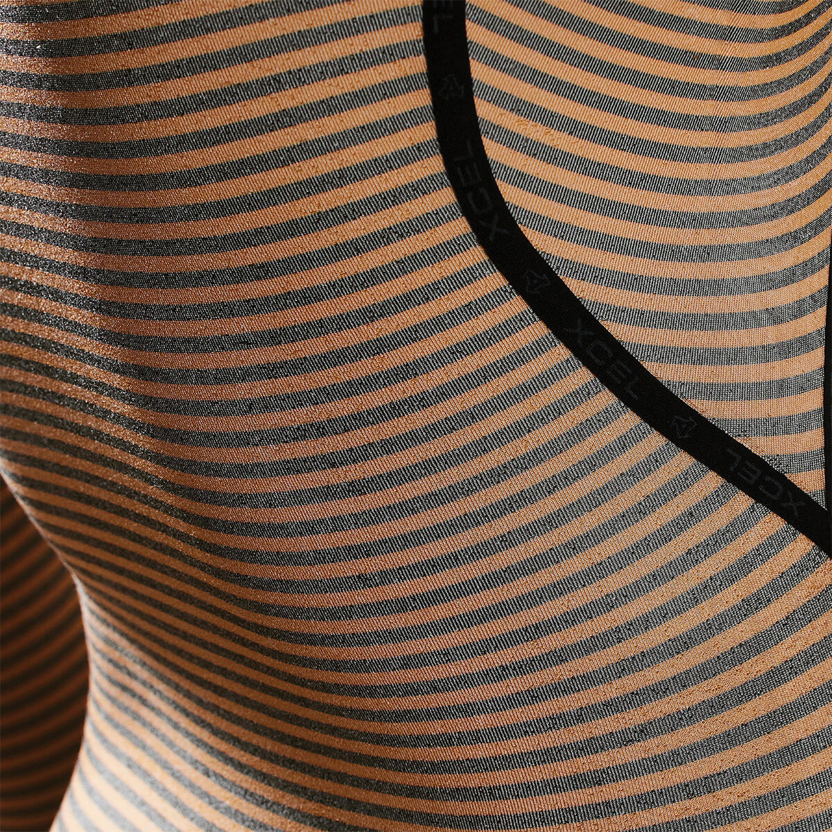 Close-up of a striped fabric with brown and black horizontal lines. shed nine 
