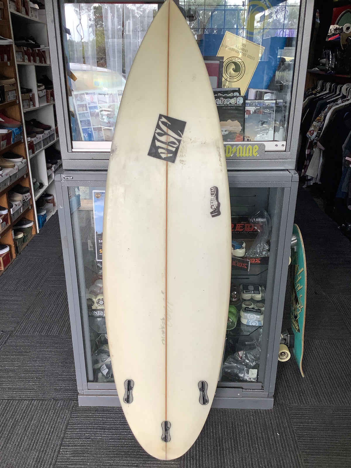 White PISC Asylum used surfboard bottom and three empty fin boxes