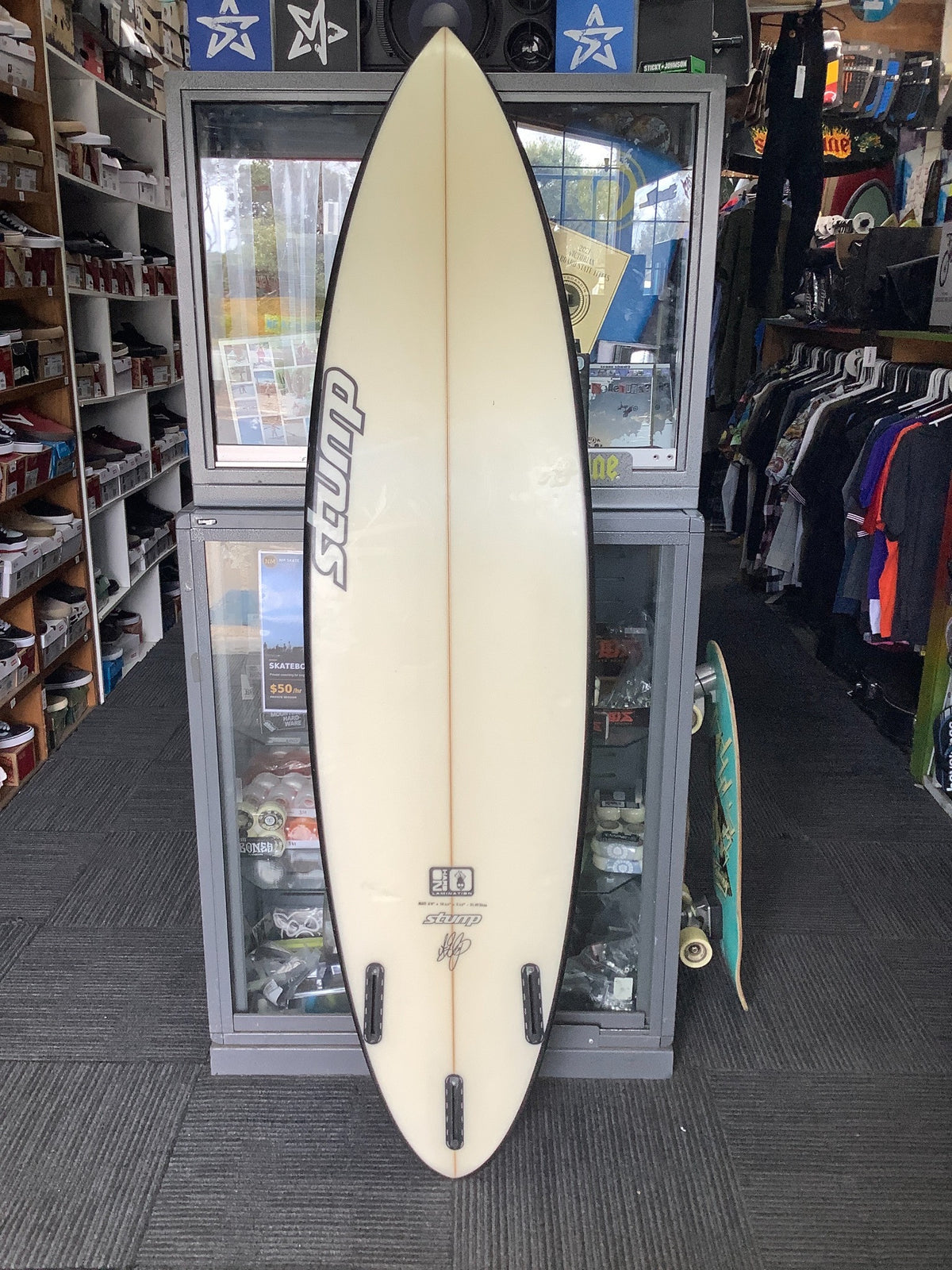 Used Stump 6'4 surfboard cream bottom with three empty fin boxes