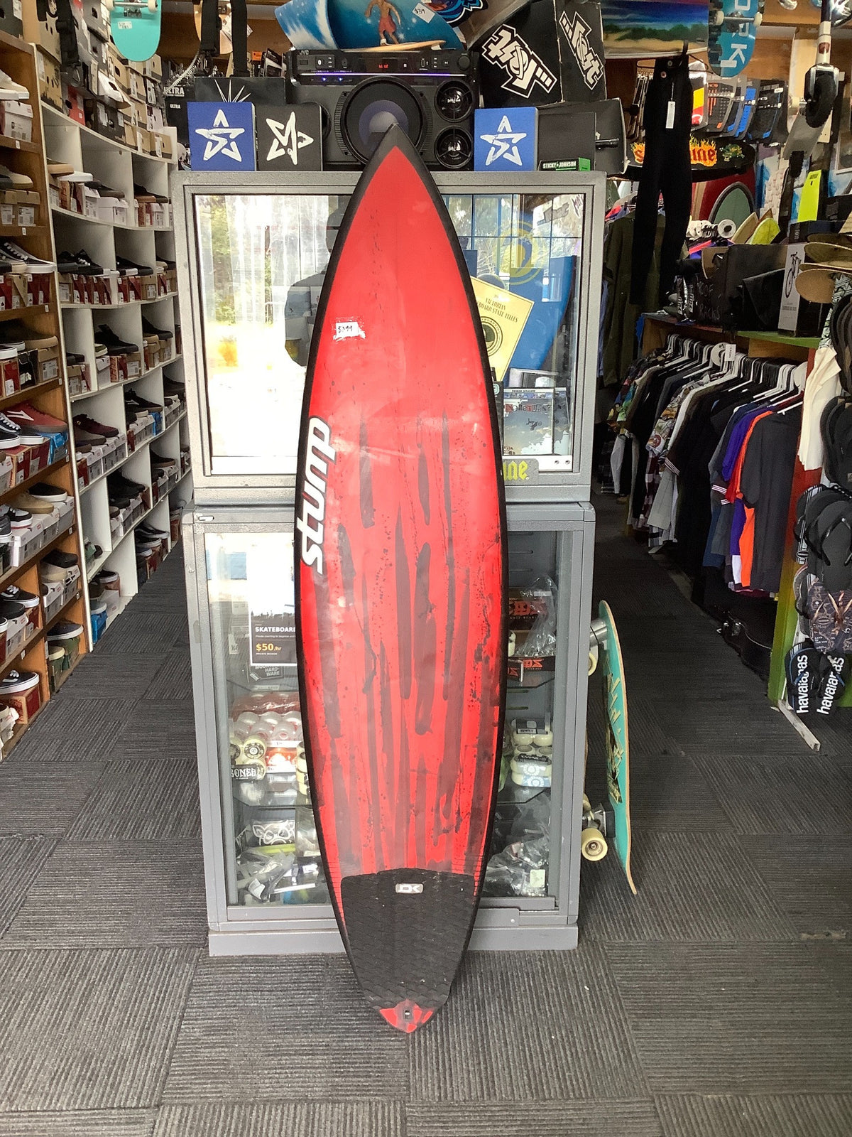 Used Stump 6'4 surfboard red and black deck with traction pad