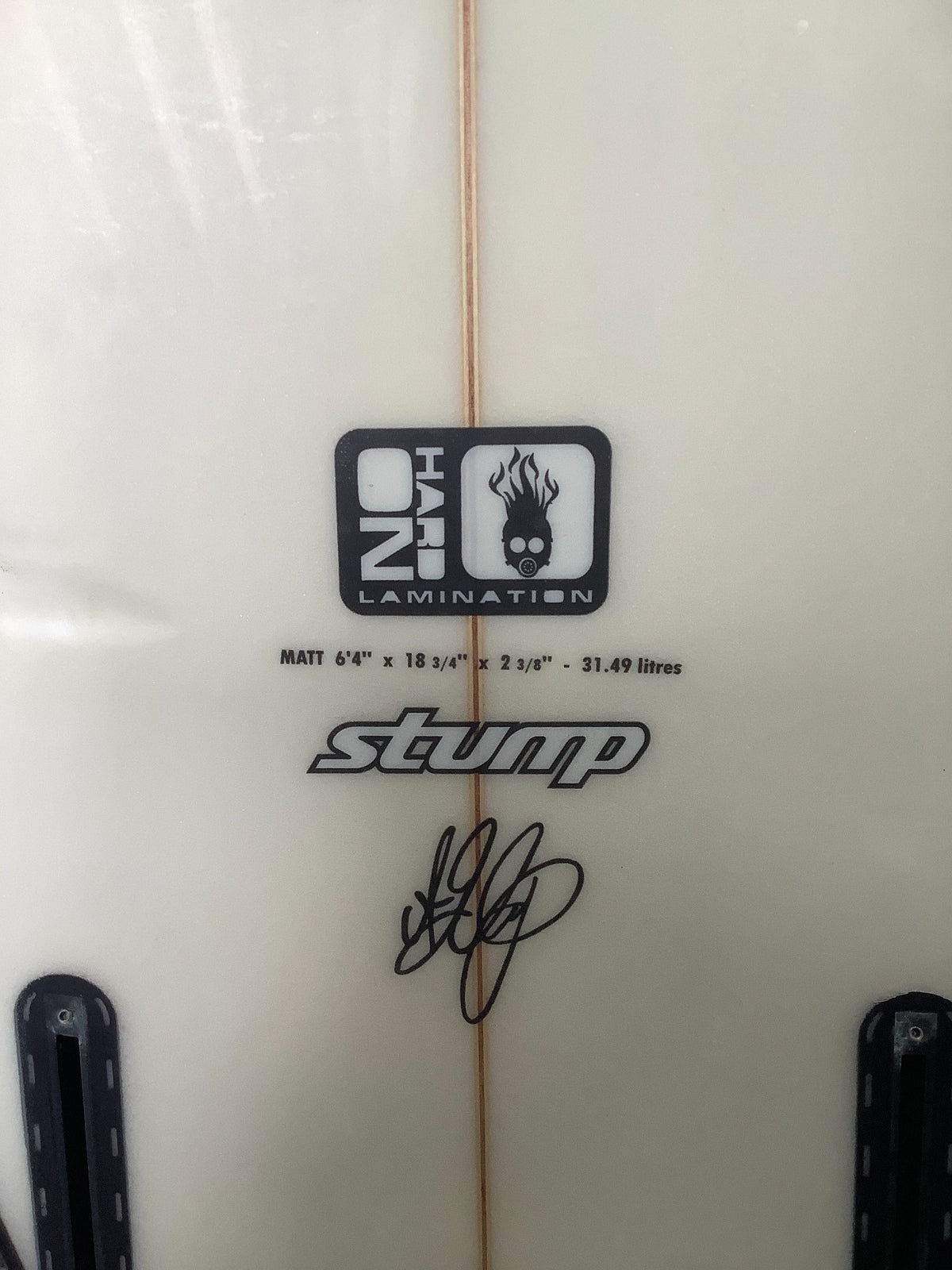 Stump surfboard branding and printed dimensions 6'4 x 18 3/4 x 2 3/8, 31.49 litres