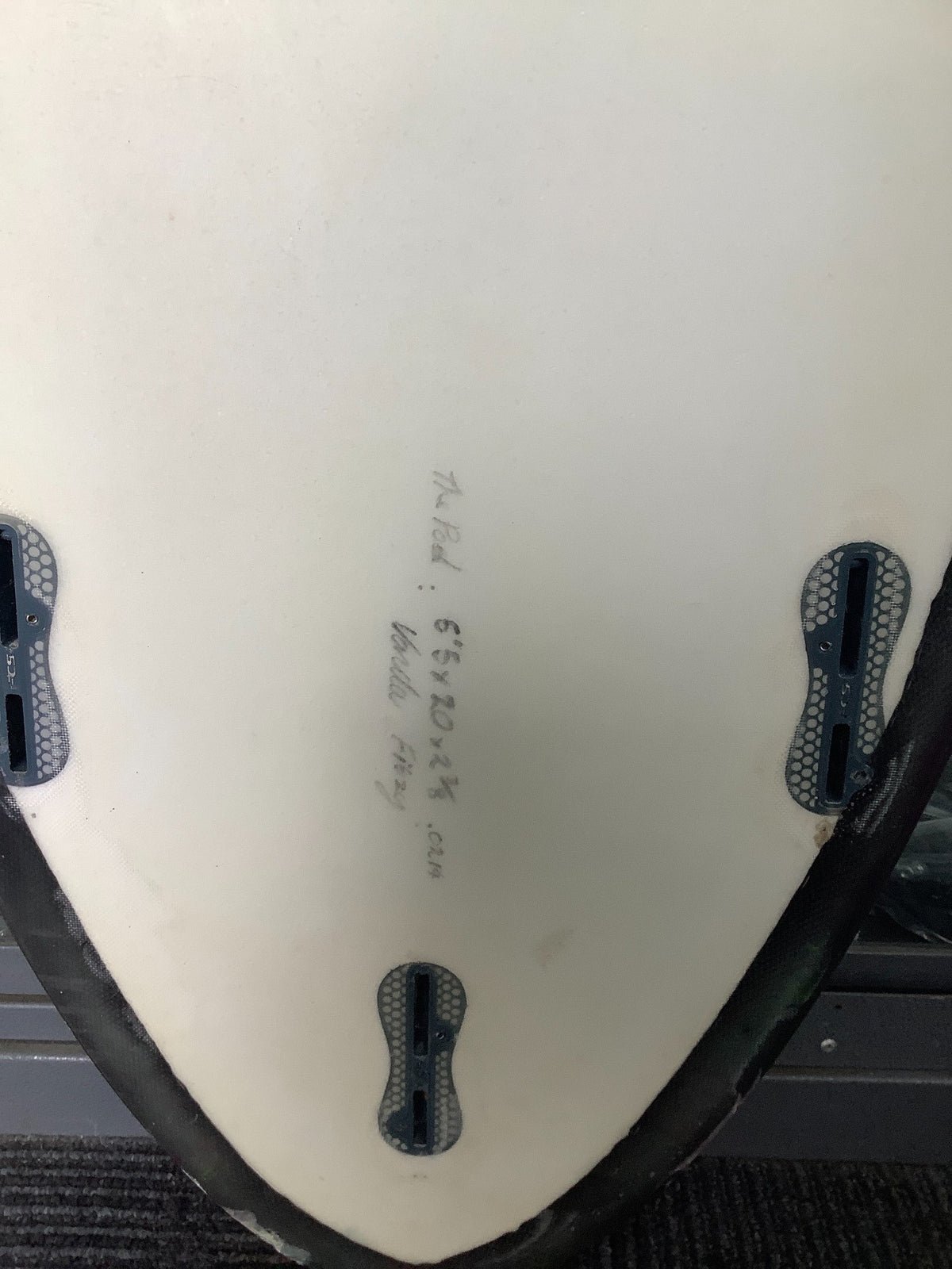 Used Vanda Pod surfboard handwritten markings and empty fin boxes