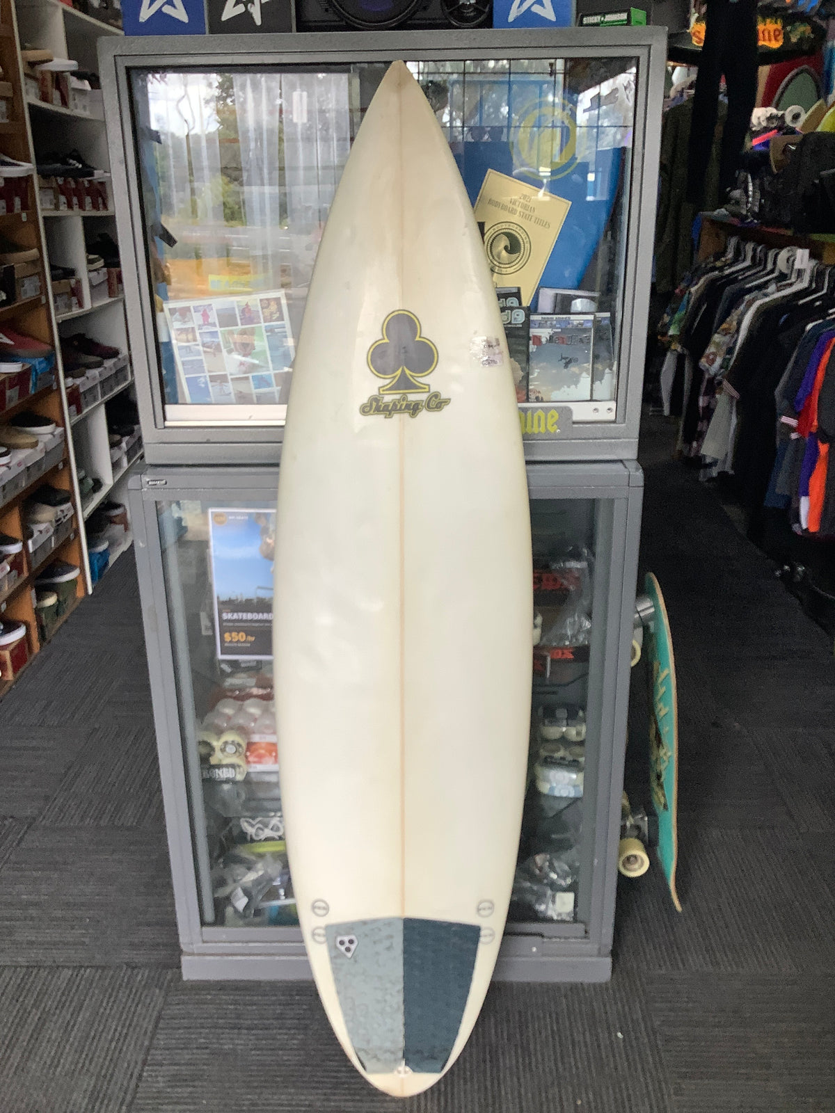 Used Darren Watson surfboard deck with Shaping Co logo and two-tone tail pad