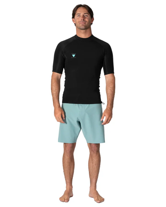 Man wearing a black Rash Guard and light blue shorts on a white background - shed nine