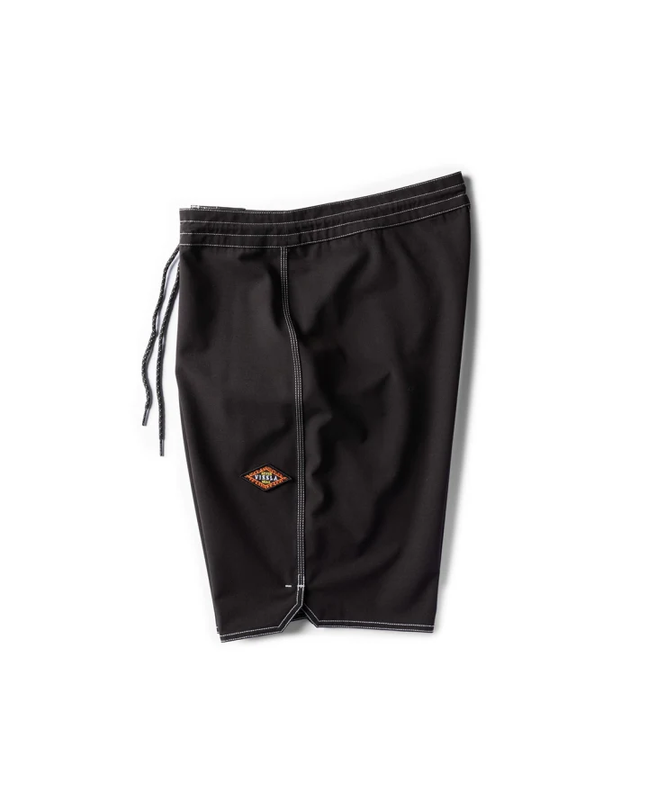 Black swim shorts with a logo on a white background shed nine