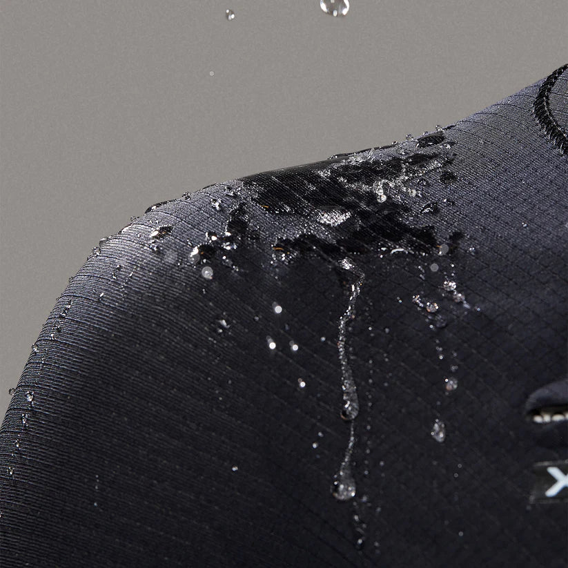 Water beading detail on Xcel Women’s Infiniti Front Zip 4/3mm Full Wetsuit in black Shed Nine